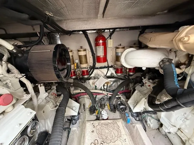 Slide: The Image of Engine room of a 1998 Sea Ray 500 Sundancer boat with fire extinguisher. - 42