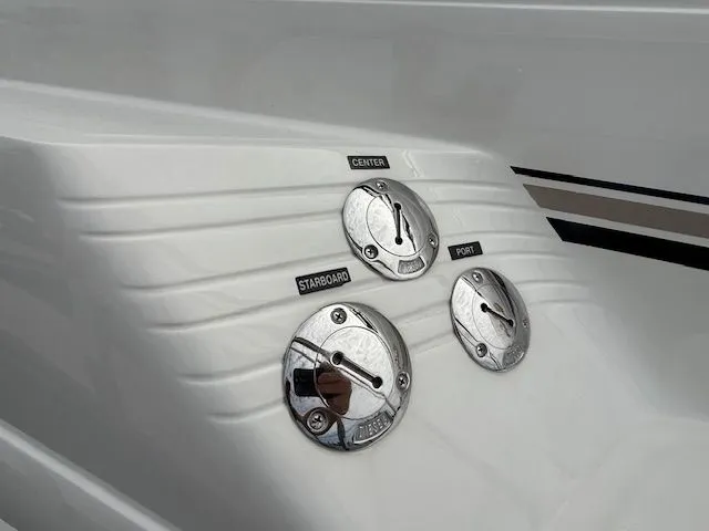 Slide: The Image of Fuel caps on 1998 Sea Ray 500 Sundancer labeled Center, Starboard, Port. - 6