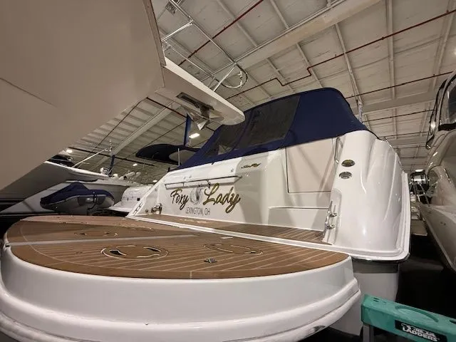 Slide: The Image of 1998 Sea Ray 500 Sundancer yacht docked indoors. - 7