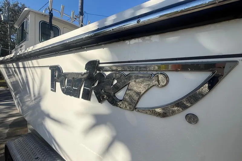 Slide: The Image of 2020 Parker 2320 SL Sport Cabin boat logo on white surface. - 12