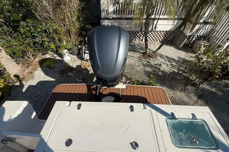 Slide: The Image of 2020 Parker 2320 SL Sport Cabin boat interior with seating and storage compartments. - 14