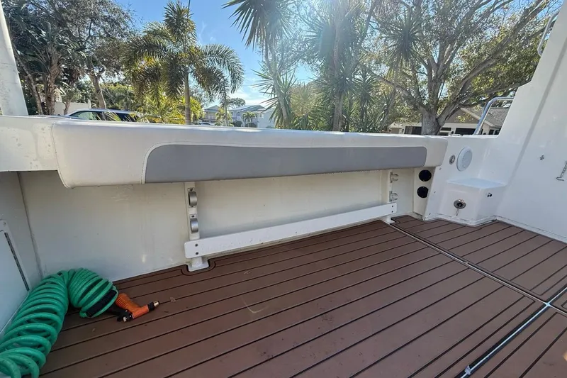 Slide: The Image of 2020 Parker 2320 SL Sport Cabin boat interior with wooden deck and steering wheel. - 19