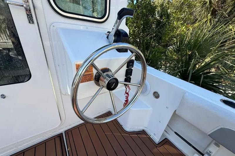 Slide: The Image of 2020 Parker 2320 SL Sport Cabin boat with rod holders and teak deck. - 21