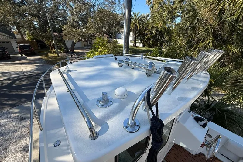 Slide: The Image of 2020 Parker 2320 SL Sport Cabin boat, side view with window and chrome handle. - 23