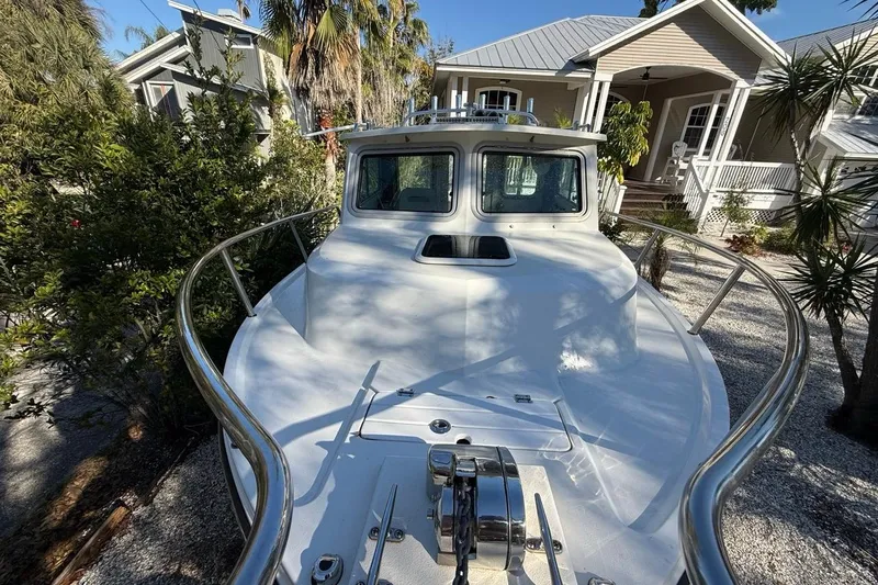 Slide: The Image of Close-up of a 2020 Parker 2320 SL Sport Cabin boat's anchor winch system. - 25