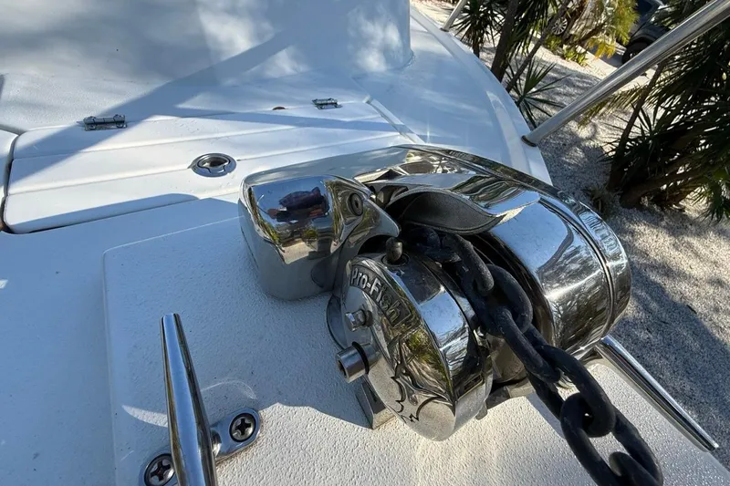 Slide: The Image of 2020 Parker 2320 SL Sport Cabin boat parked near a house, side view. - 26