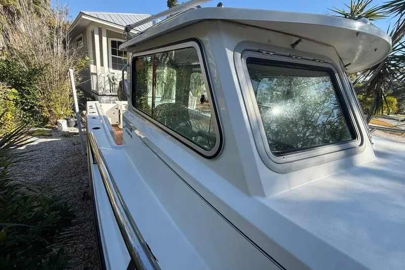 Slide: The Image of 2020 Parker 2320 SL Sport Cabin boat with sleek cabin design and modern features. - 27