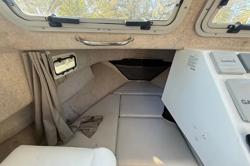 Slide: The Image of Interior of 2020 Parker 2320 SL Sport Cabin with curtain and Garmin equipment. - 31