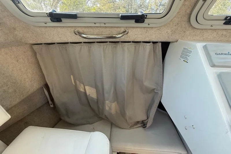 Slide: The Image of Interior view of 2020 Parker 2320 SL Sport Cabin with windows and fan. - 32