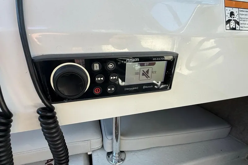 Slide: The Image of Control panel of a 2020 Parker 2320 SL Sport Cabin boat with circuit breakers. - 39