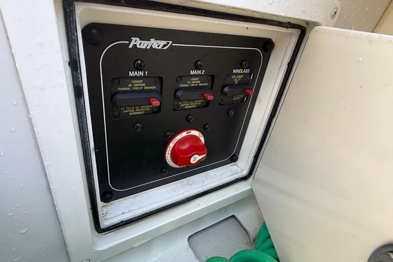 Slide: The Image of 2020 Parker 2320 SL Sport Cabin boat on trailer, surrounded by palm trees. - 40