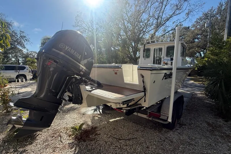 Slide: The Image of Rear view of 2020 Parker 2320 SL Sport Cabin boat with powerful outboard motor. - 7