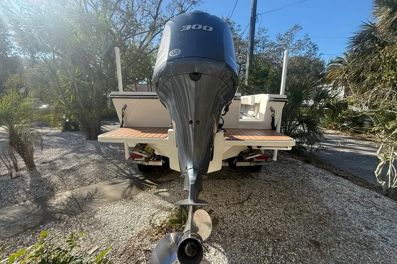 Slide: The Image of 2020 Parker 2320 SL Sport Cabin boat with Yamaha outboard motor on trailer. - 8