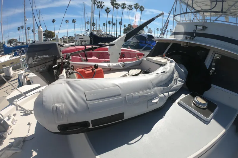 Slide: The Image of 1984 Uniflite 38 Convertible with inflatable boat and Nissan outboard motor. - 10