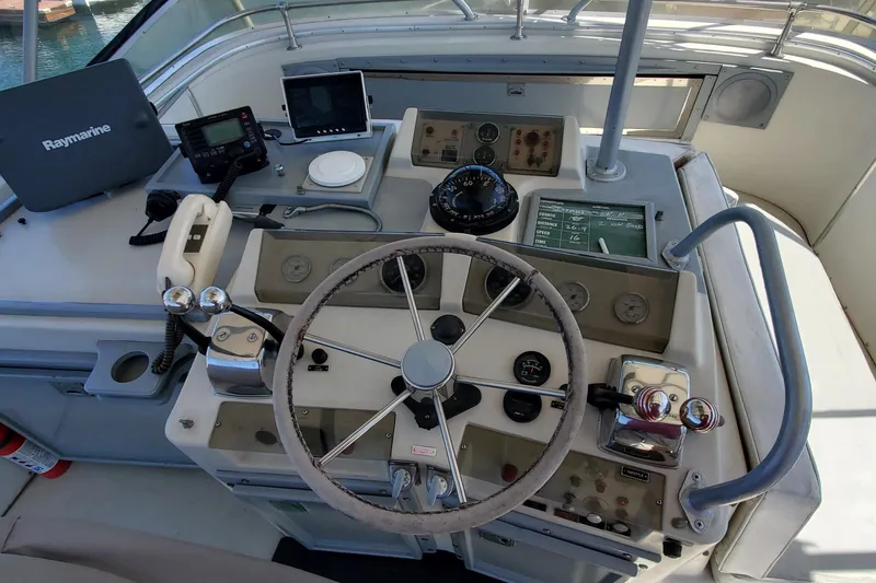 Slide: The Image of Cockpit of 1984 Uniflite 38 Convertible with navigation equipment and steering wheel. - 15