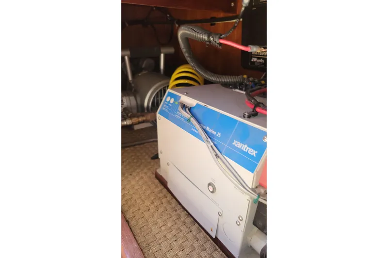 Slide: The Image of Electrical equipment inside 1984 Uniflite 38 Convertible boat, featuring Xantrex inverter. - 30