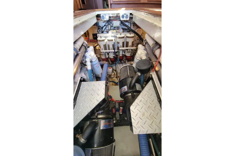 Slide: The Image of Engine room of 1984 Uniflite 38 Convertible boat with visible machinery and components. - 32
