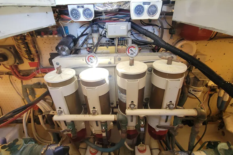 Slide: The Image of Engine room of a 1984 Uniflite 38 Convertible with fuel filters and gauges. - 33