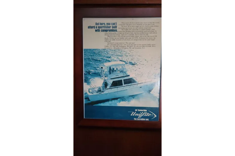 Slide: The Image of 1984 Uniflite 38 Convertible boat advertisement, showcasing a sportfisher on the ocean. - 36