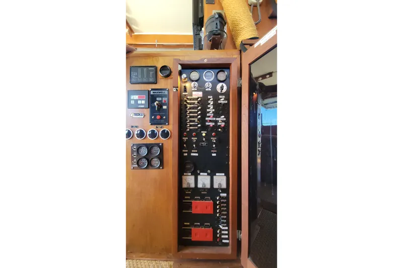Slide: The Image of Engine room of a 1984 Uniflite 38 Convertible with fuel filters and gauges. - 38