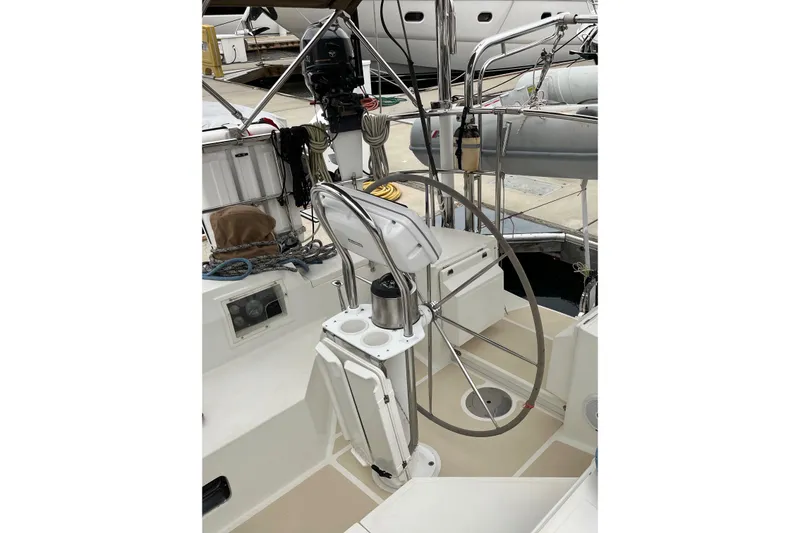 Slide: The Image of 2011 Outbound 46 sailboat cockpit with steering wheel and equipment. - 17