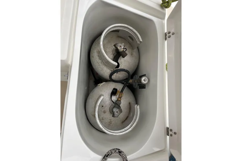 Slide: The Image of Propane tanks in storage compartment of 2011 Outbound 46 boat. - 19