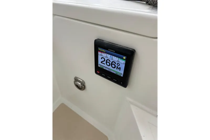 Slide: The Image of Garmin auto pilot display on 2011 Outbound 46 yacht, showing 266° heading. - 20