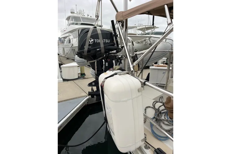 Slide: The Image of Outbound 46 sailboat with 15 hp Tohatsu outboard and rail mounted life raft - 22