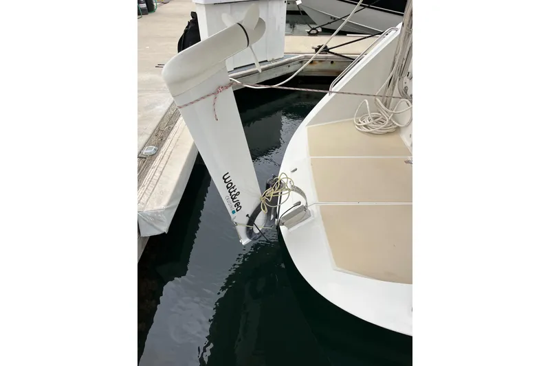 Slide: The Image of Sailboat stern with wind vane, Outbound 46, 2011 model, docked at marina. - 24