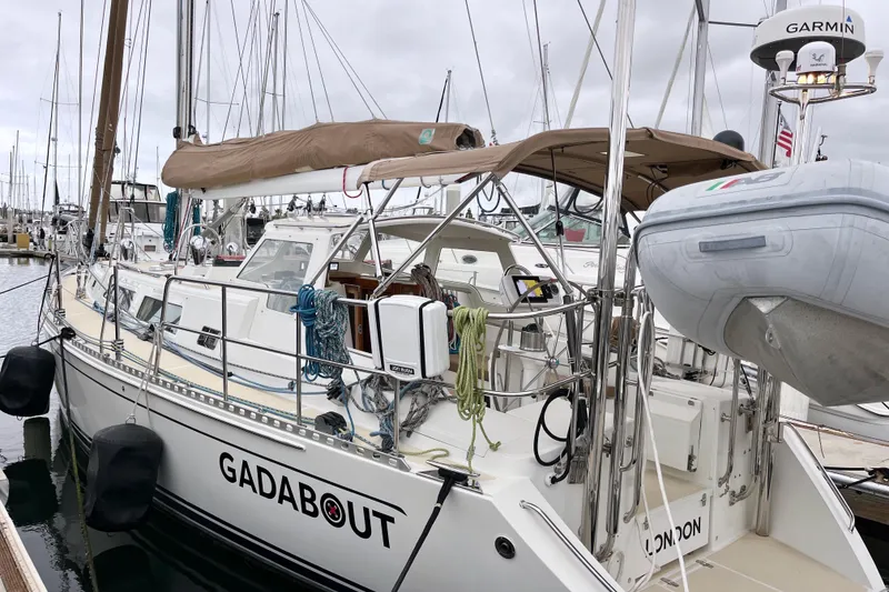 Slide: The Image of Sailboat "GADABOUT" docked, Outbound 46 model, 2011, with toast covers and marine equipment. - 29