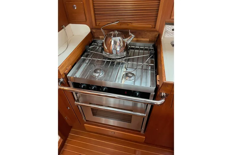 Slide: The Image of Galley in 2011 Outbound 46 yacht with stove and kettle. - 38