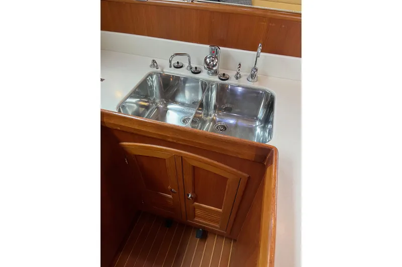Slide: The Image of Outbound 46 yacht kitchen sink, stainless steel, wooden cabinetry, 2011 model. - 40