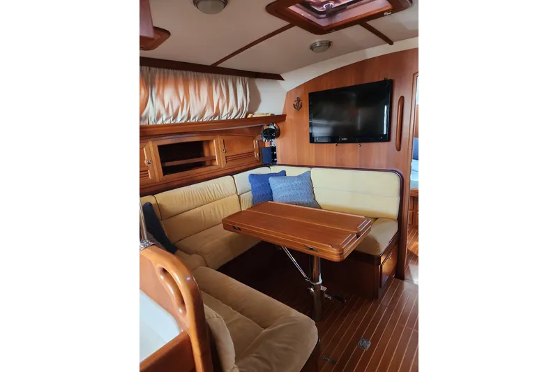 Slide: The Image of Luxurious interior of 2011 Outbound 46 yacht with cozy seating and wooden finishes. - 43
