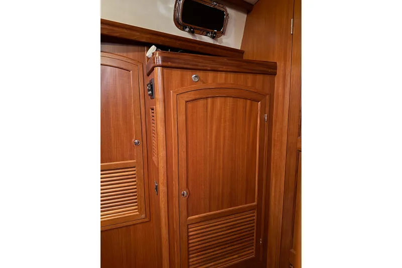 Slide: The Image of Wooden interior cabinetry in master stateroom of a 2011 Outbound 46 yacht, featuring elegant design and craftsmanship. - 50