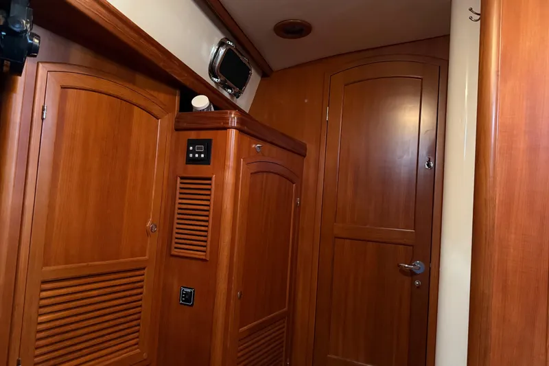 Slide: The Image of Interior cabinetry in master stateroom of a 2011 Outbound 46 yacht wit door to salon closed - 51