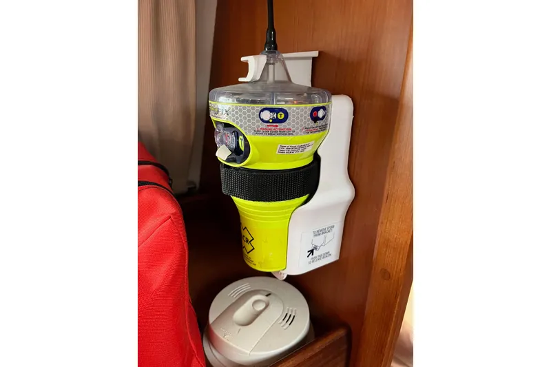 Slide: The Image of Emergency beacon mounted on a 2011 Outbound 46 yacht interior. - 60