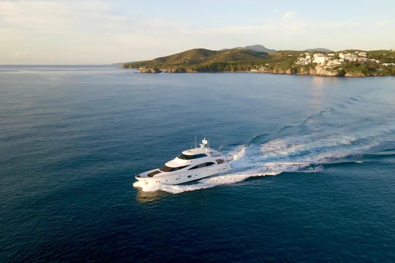 Slide: The Image of Luxurious 2011 Horizon E88 yacht cruising on open sea at sunset. - 11