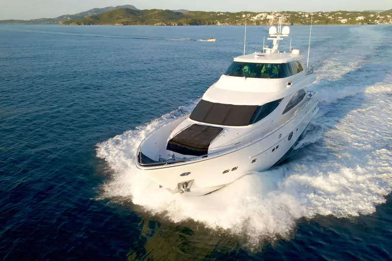 Slide: The Image of Luxurious 2011 Horizon E88 yacht cruising on open sea at sunset. - 13