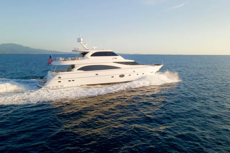 Slide: The Image of Luxurious 2011 Horizon E88 yacht cruising on open sea at sunset. - 16