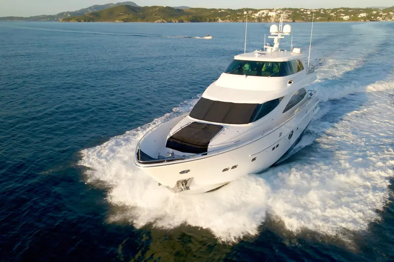 Slide: The Image of Luxurious 2011 Horizon E88 yacht cruising on calm ocean waters at sunset. - 17