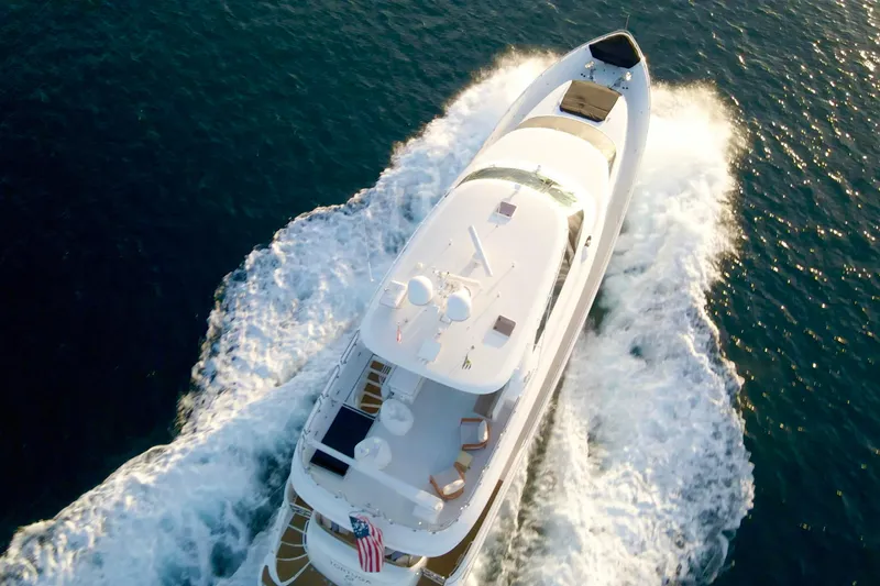 Slide: The Image of Luxurious 2011 Horizon E88 yacht cruising on open sea at sunset. - 18