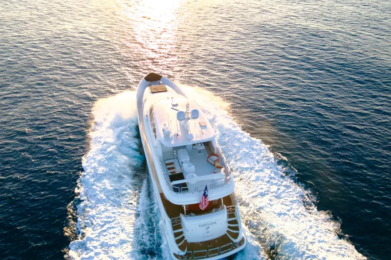 Slide: The Image of Luxurious 2011 Horizon E88 yacht cruising on open sea under clear skies. - 21