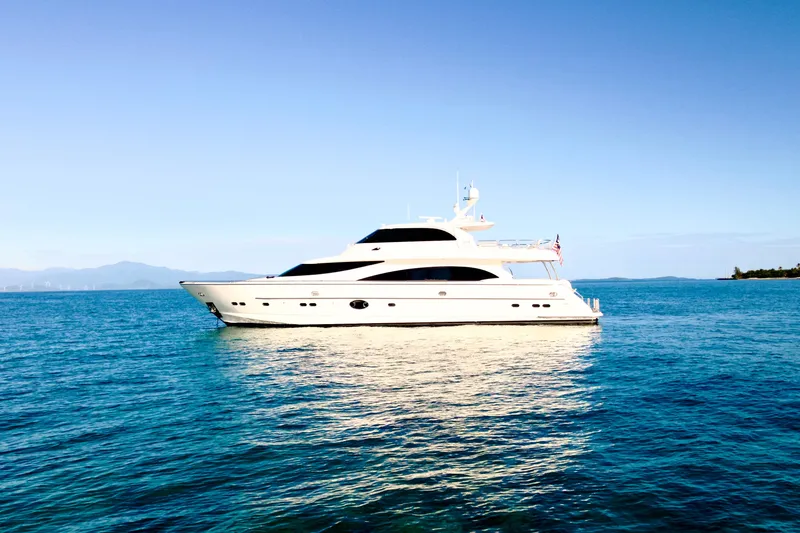 Slide: The Image of Luxurious 2011 Horizon E88 yacht with spacious deck and elegant seating, cruising on calm waters. - 27