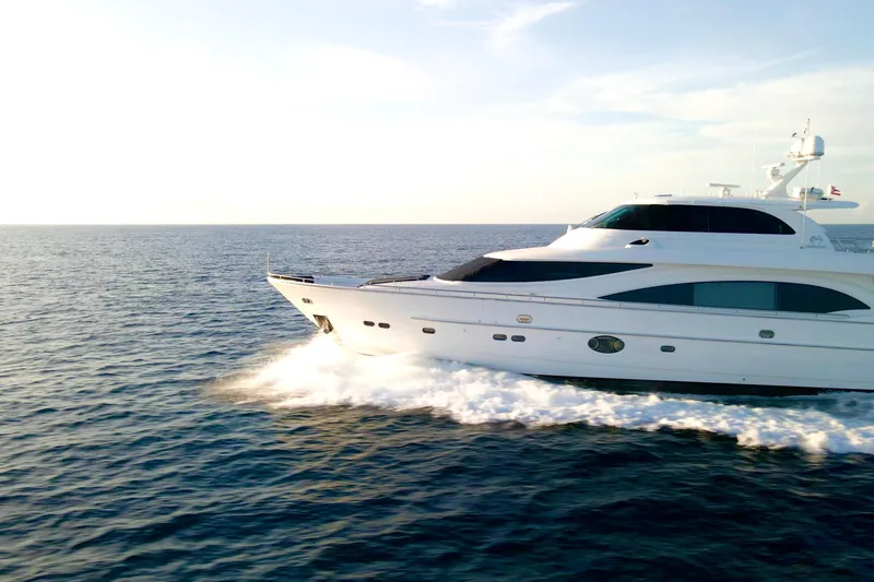 Slide: The Image of Luxurious 2011 Horizon E88 yacht cruising on clear blue ocean waters. - 29