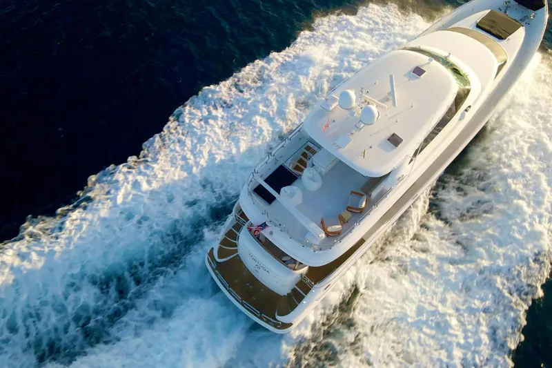 Slide: The Image of Luxurious 2011 Horizon E88 yacht on clear turquoise waters, aerial view. - 30