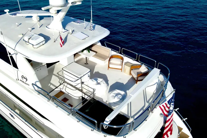 Slide: The Image of Luxurious bathroom with dual sinks, marble countertop, and elegant decor on Horizon E88 yacht. - 35