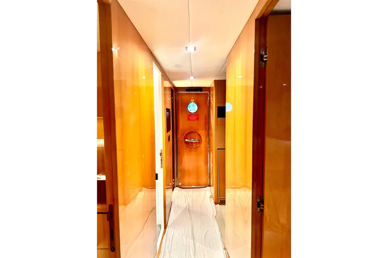 Slide: The Image of Luxurious cabin interior of 2011 Horizon E88 yacht with wooden finishes and cozy bedding. - 37