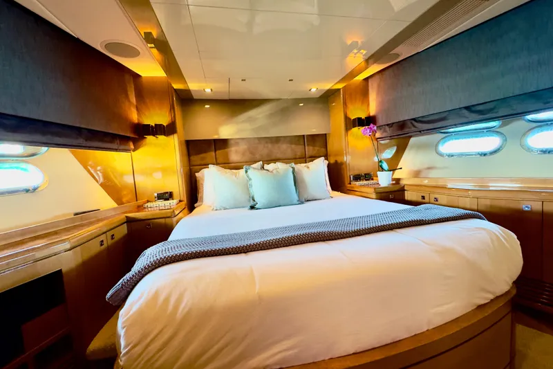 Slide: The Image of Luxurious bedroom interior on 2011 Horizon E88 yacht with elegant wood finishes and soft lighting. - 45