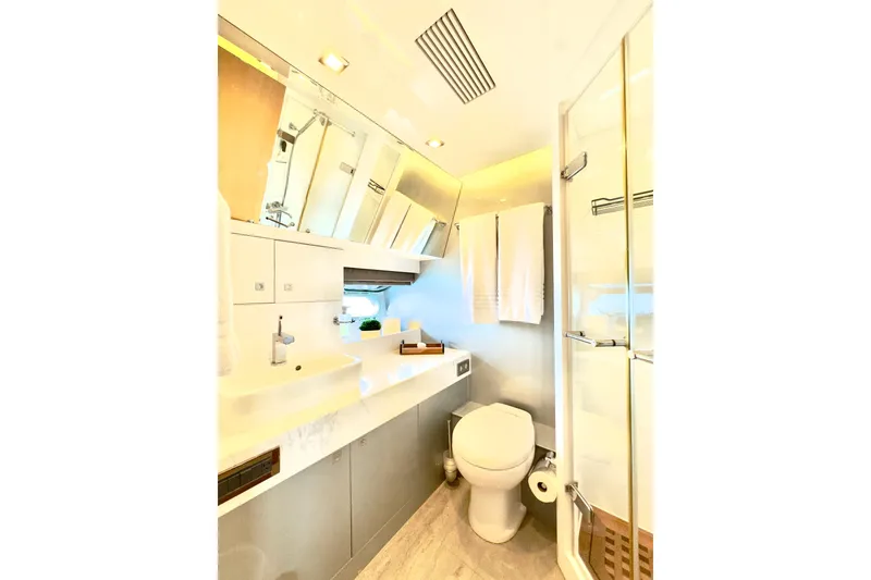 Slide: The Image of Luxurious bathroom in 2011 Horizon E88 yacht with modern fixtures and elegant design. - 48