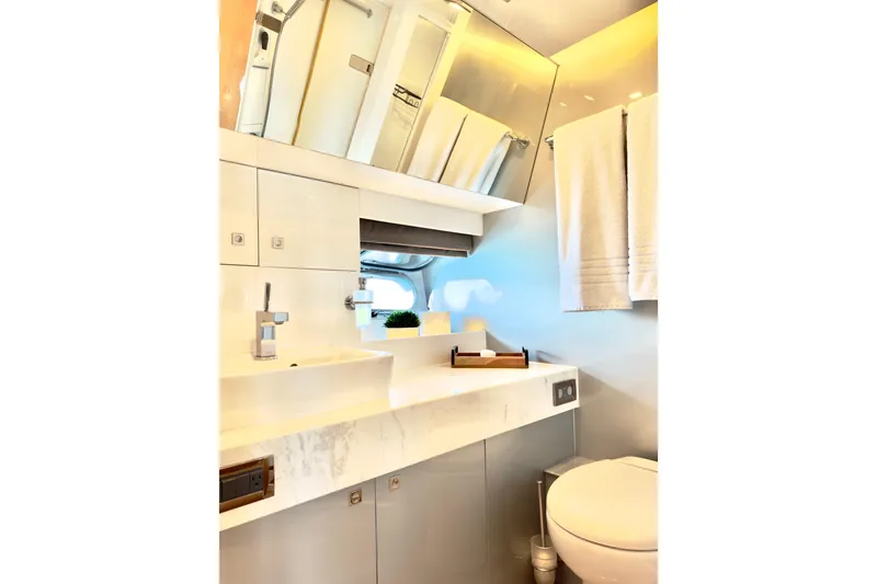 Slide: The Image of Luxurious bathroom interior on 2011 Horizon E88 yacht, featuring modern fixtures and elegant design. - 49